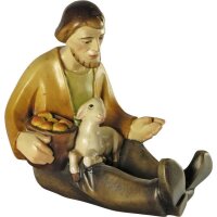 Sitting shepherd with with sheep