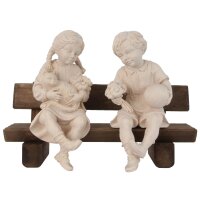 Boy and girl sitting on bench