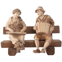 Zither- und Ziehharmonikaspieler sitzend auf Bank