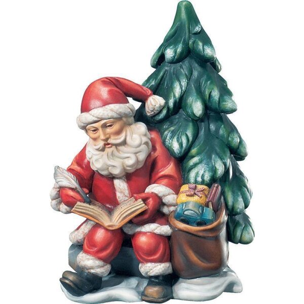 Santa Claus with book and tree