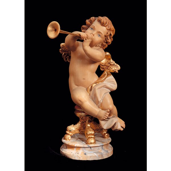 Sitting angel with trumpet