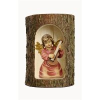 Bell angel with guitar in a tree trunk