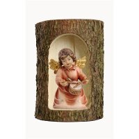 Bell angel with drum in a tree trunk