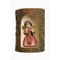 Bell angel with bird in a tree trunk