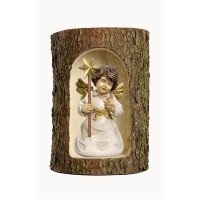 Bell angel with star in a tree trunk
