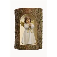 Bell angel, stand. praying in a tree trunk