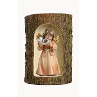 Bell angel, stand. with horn in a tree trunk