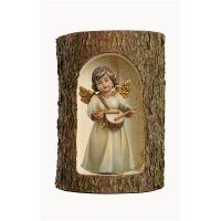 Bell angel, stand. with drum in a tree trunk