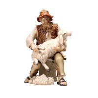 KO Shepherd sitting with sheep