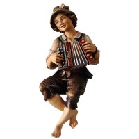 Boy sitting with concertina