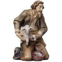 Pastore inginocchiato con capra